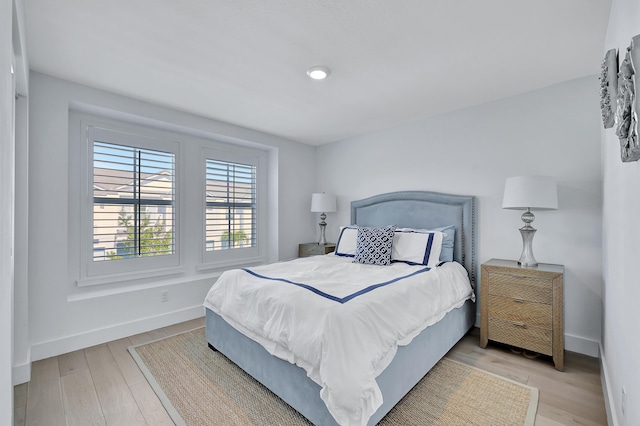 bedroom with light hardwood / wood-style floors