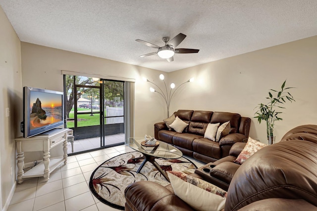 tiled living room with ceiling fan and a textured ceiling