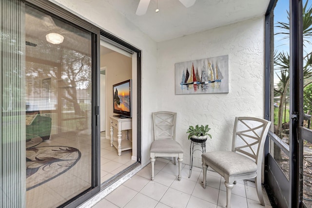 sunroom / solarium with ceiling fan