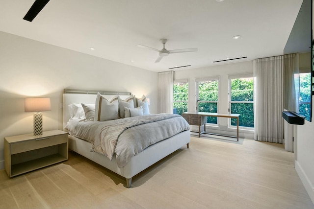 bedroom featuring ceiling fan and light hardwood / wood-style flooring