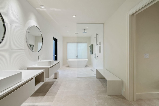 bathroom with tile patterned flooring, vanity, and separate shower and tub