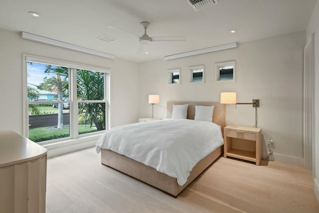 bedroom featuring ceiling fan and light hardwood / wood-style flooring