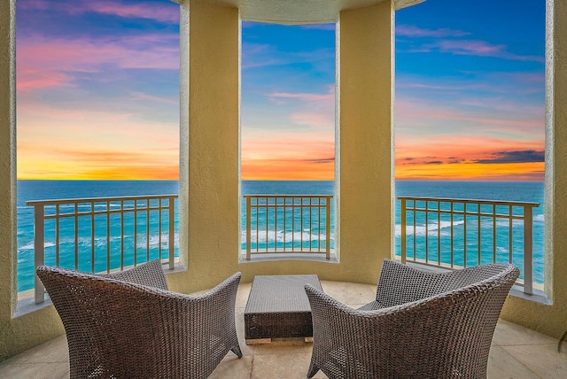 balcony featuring a water view