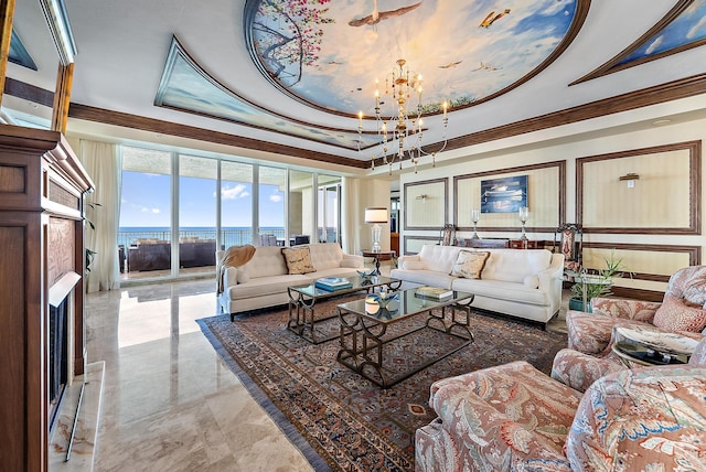 5310 N Ocean Dr Unit Ph-1201, Singer Island, FL 33404 - living room featuring a notable chandelier, a tray ceiling, and ornamental molding