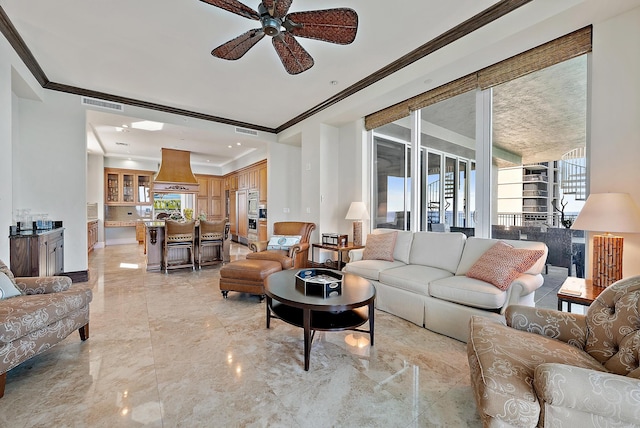 5310 N Ocean Dr Unit Ph-1201, Singer Island, FL 33404 - living area featuring ceiling fan, visible vents, marble finish floor, and ornamental molding