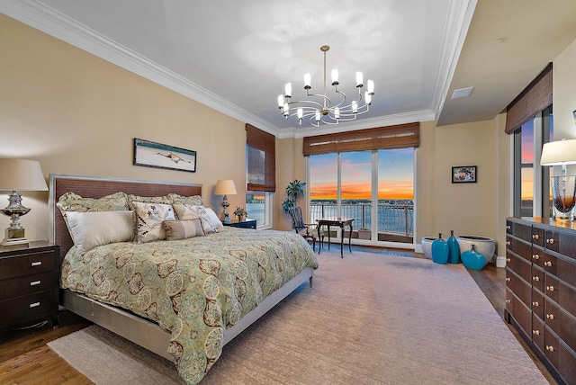 5310 N Ocean Dr Unit Ph-1201, Singer Island, FL 33404 - bedroom featuring access to exterior, wood finished floors, crown molding, and a chandelier
