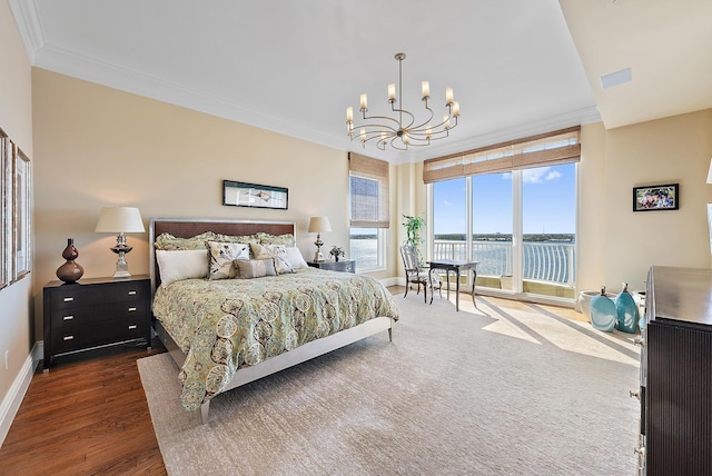 5310 N Ocean Dr Unit Ph-1201, Singer Island, FL 33404 - bedroom featuring wood finished floors, a water view, an inviting chandelier, and ornamental molding