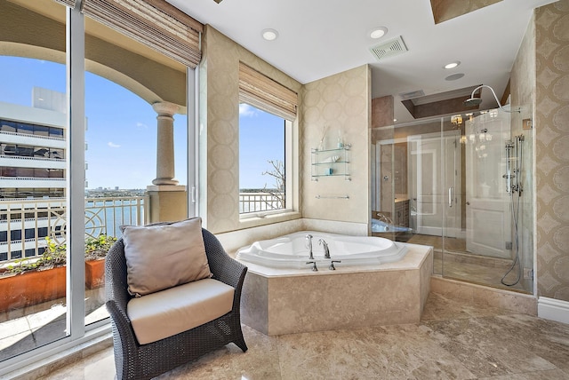 5310 N Ocean Dr Unit Ph-1201, Singer Island, FL 33404 - bathroom with a bath, visible vents, a stall shower, and decorative columns