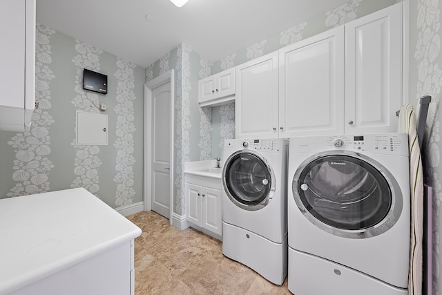 5310 N Ocean Dr Unit Ph-1201, Singer Island, FL 33404 - clothes washing area featuring a sink, washing machine and dryer, cabinet space, wallpapered walls, and baseboards