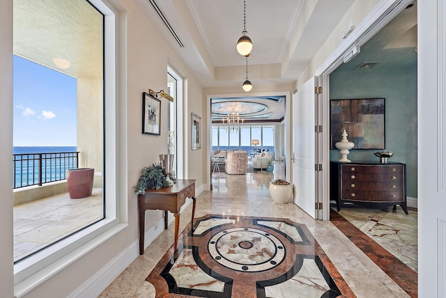 5310 N Ocean Dr Unit Ph-1201, Singer Island, FL 33404 - foyer entrance with baseboards, a raised ceiling, marble finish floor, and ornamental molding