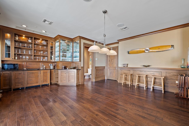 5310 N Ocean Dr Unit Ph-1201, Singer Island, FL 33404 - bar with visible vents, dark wood-style flooring, a wainscoted wall, and black microwave