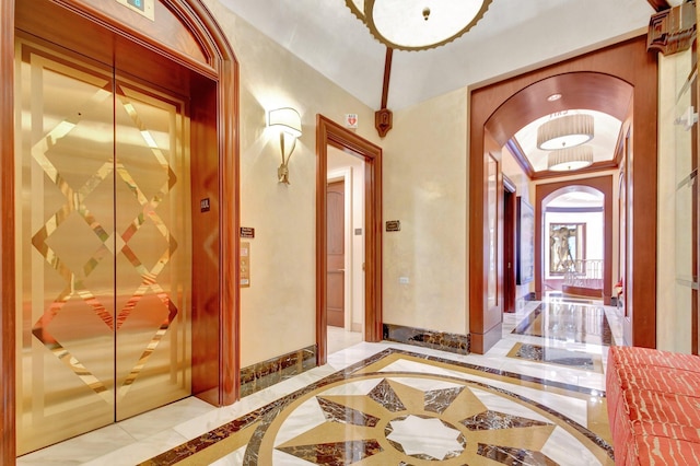 5310 N Ocean Dr Unit Ph-1201, Singer Island, FL 33404 - hall with elevator, marble finish floor, and baseboards