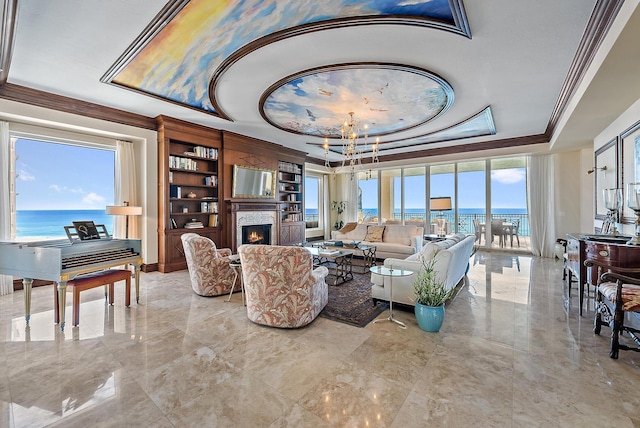 5310 N Ocean Dr Unit Ph-1201, Singer Island, FL 33404 - living area featuring an inviting chandelier, a warm lit fireplace, crown molding, a raised ceiling, and marble finish floor