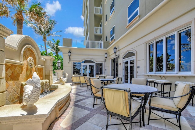 5310 N Ocean Dr Unit Ph-1201, Singer Island, FL 33404 - view of patio with outdoor dining space and french doors
