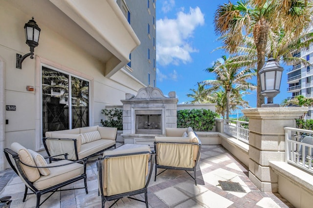 5310 N Ocean Dr Unit Ph-1201, Singer Island, FL 33404 - view of patio / terrace featuring an outdoor living space with a fireplace