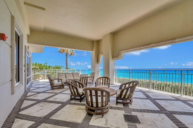 5310 N Ocean Dr Unit Ph-1201, Singer Island, FL 33404 - view of patio featuring visible vents, a water view, outdoor lounge area, and a view of the beach
