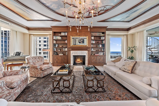 5310 N Ocean Dr Unit Ph-1201, Singer Island, FL 33404 - living room with a chandelier, built in shelves, crown molding, and a premium fireplace
