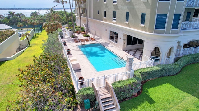 5310 N Ocean Dr Unit Ph-1201, Singer Island, FL 33404 - community pool with a water view, a patio, fence, a yard, and stairs