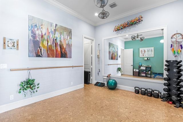 exercise room featuring crown molding and a chandelier