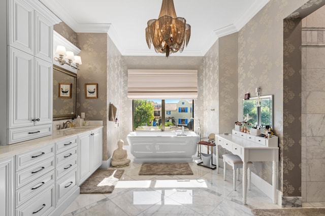 bathroom with a bath, vanity, ornamental molding, and a notable chandelier