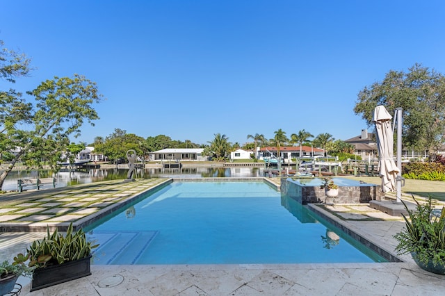 view of pool with a water view