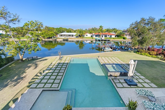 view of pool featuring a lawn and a water view