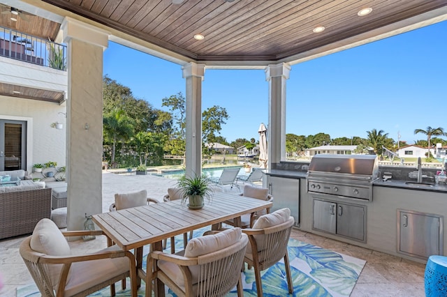 view of patio featuring a grill and exterior kitchen