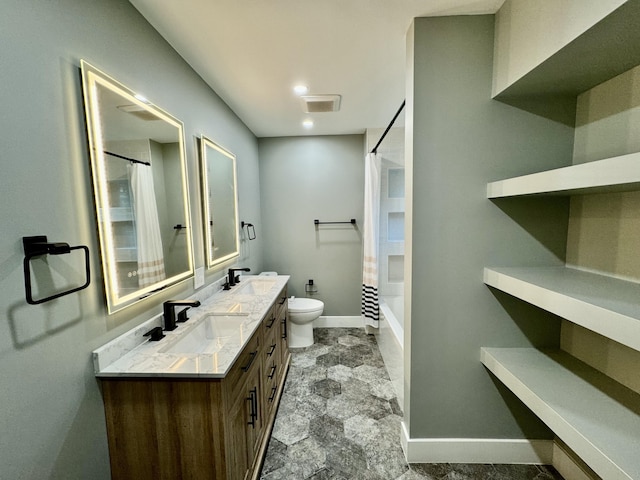 full bathroom with shower / tub combo with curtain, vanity, and toilet