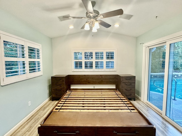 miscellaneous room with ceiling fan, light wood-type flooring, and vaulted ceiling