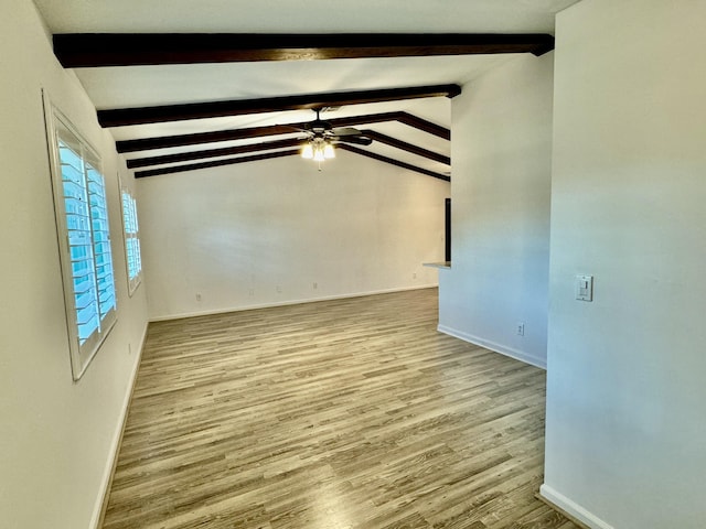 unfurnished room featuring vaulted ceiling with beams, ceiling fan, and light hardwood / wood-style floors