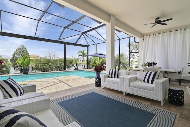 exterior space with an outdoor hangout area, a patio area, ceiling fan, and a lanai