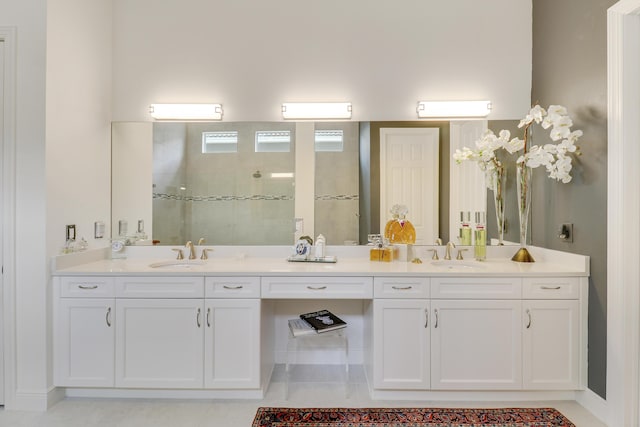 bathroom with vanity and a shower