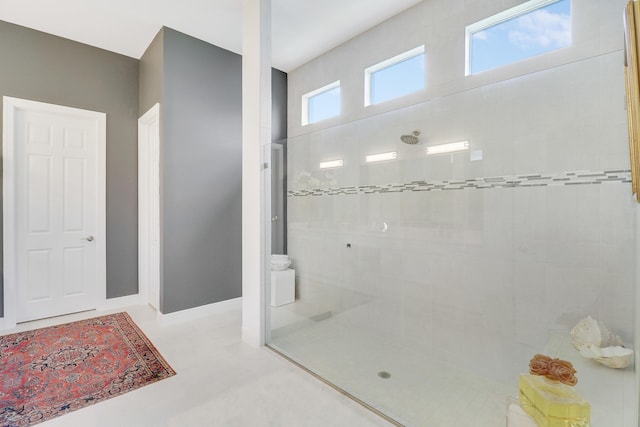 bathroom with a tile shower