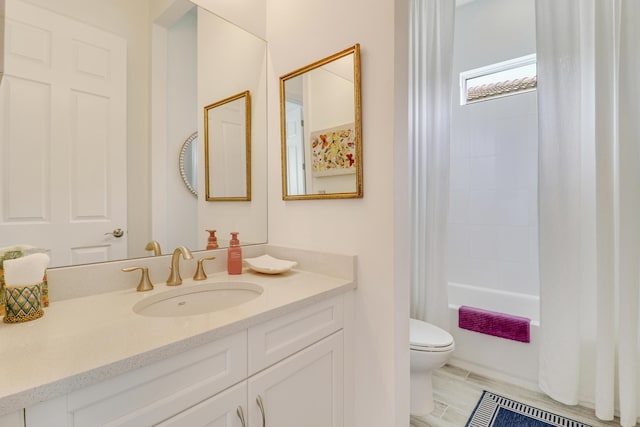 full bathroom featuring shower / tub combo with curtain, vanity, and toilet