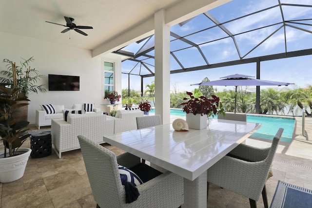 view of patio / terrace featuring ceiling fan, an outdoor hangout area, and glass enclosure