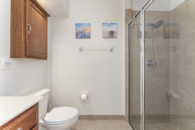 full bathroom with toilet, tile patterned floors, a shower stall, and vanity