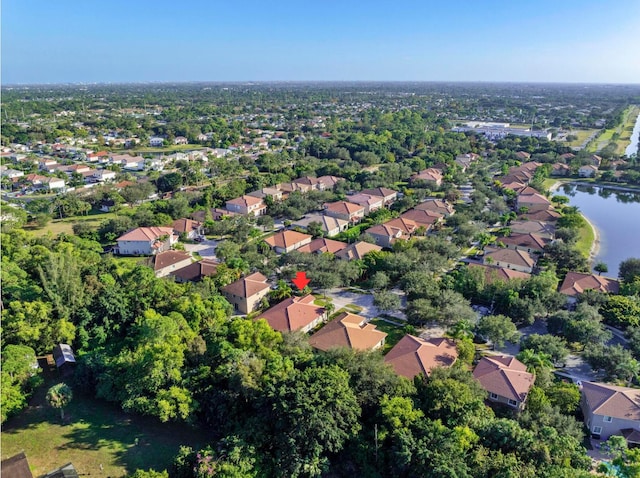 aerial view with a residential view and a water view