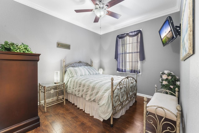 bedroom with dark wood-style floors, crown molding, baseboards, and ceiling fan