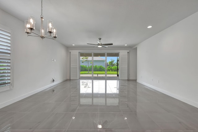 spare room with light tile patterned floors and ceiling fan with notable chandelier