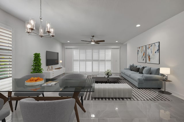 living room with ceiling fan with notable chandelier