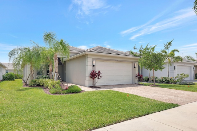 single story home with a front lawn and a garage