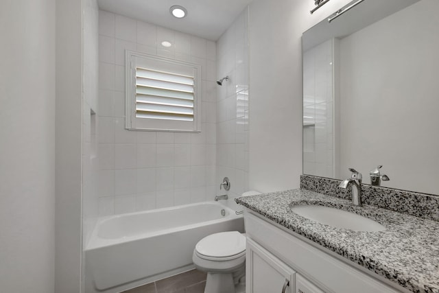 full bathroom with tile patterned floors, vanity, toilet, and tiled shower / bath