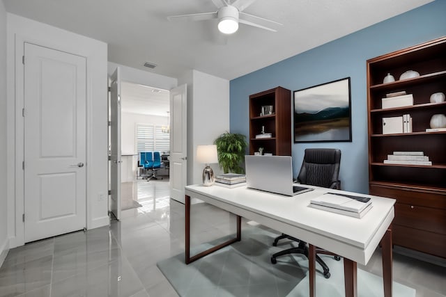 office area featuring light tile patterned floors, built in features, and ceiling fan