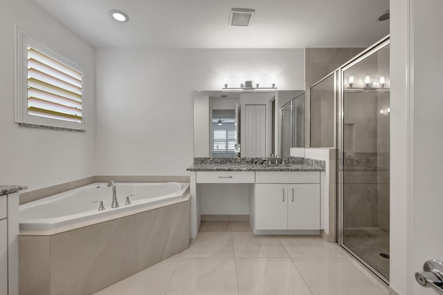 bathroom featuring tile patterned floors, plus walk in shower, vanity, and a healthy amount of sunlight