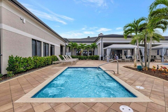 view of swimming pool featuring a gazebo and a patio