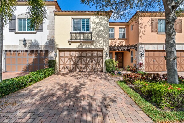 mediterranean / spanish-style home featuring a garage