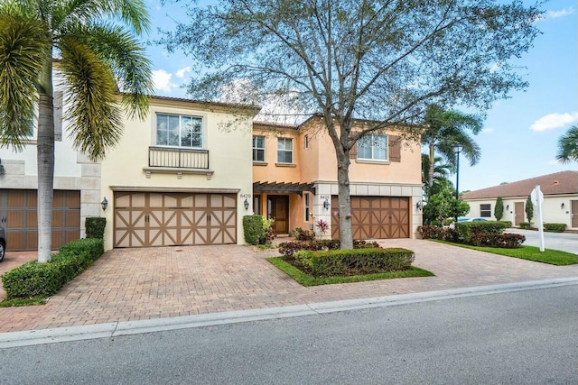 mediterranean / spanish house featuring a garage