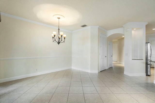 tiled empty room with ornamental molding and a notable chandelier