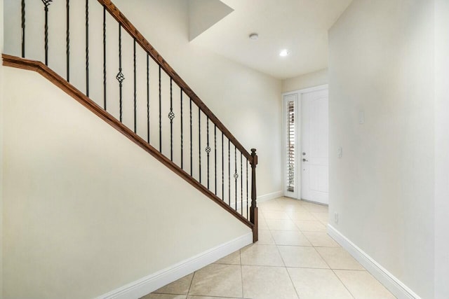 entryway with light tile patterned floors