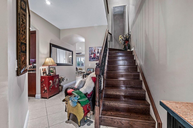 stairway featuring tile patterned floors